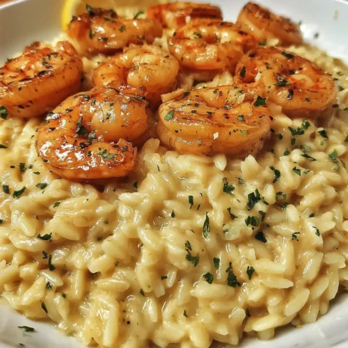 Recipe card image for orzo with shrimp showing a creamy shrimp orzo bowl with lemon and parsley.